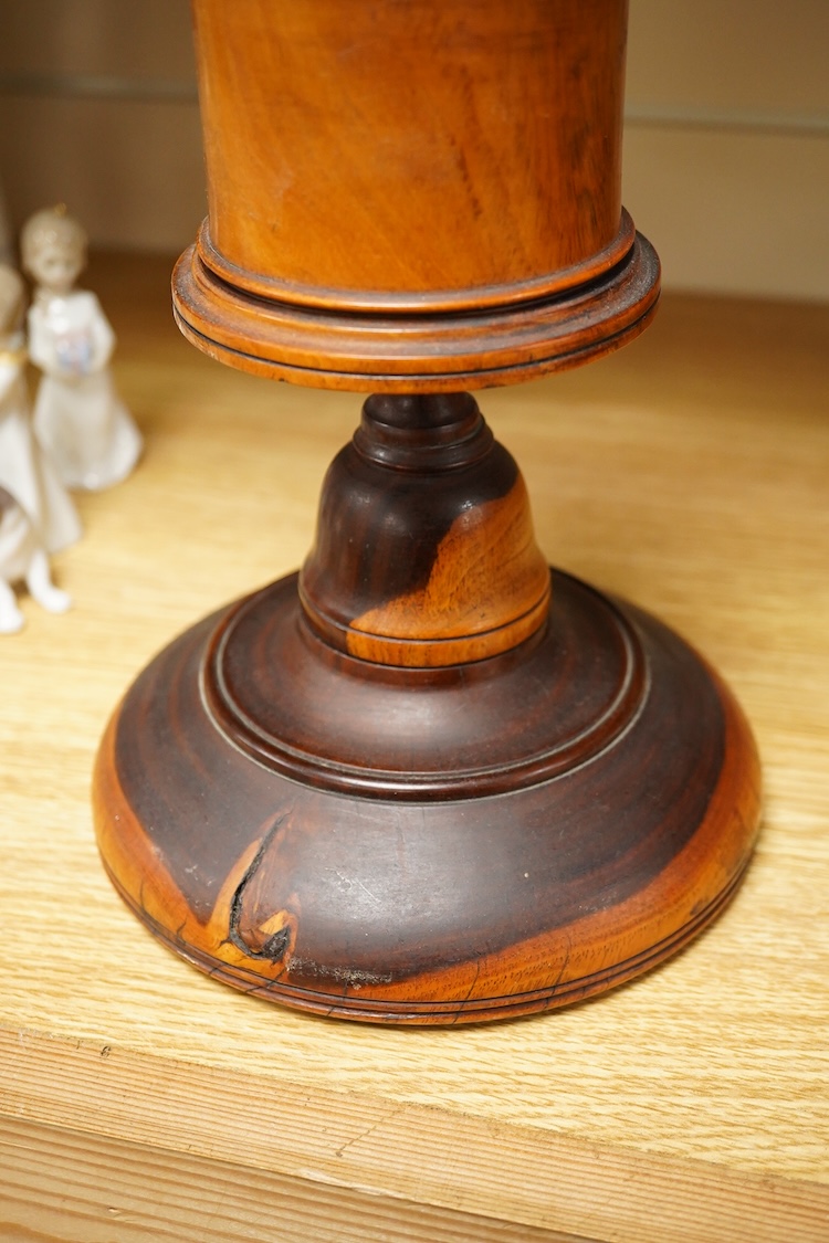 A 19th century treen lignum vitae pestle and mortar and turned cup and cover on stand- 25cm high